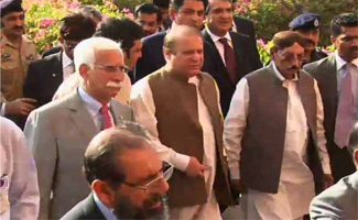 PM visits Hamid Mir, chairs meeting on law, order