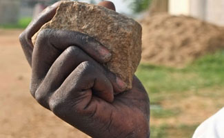 Man stones wife to death