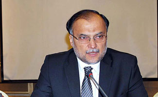 Government determined to resolve issue politically: Ahsan Iqbal