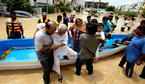 Police rescuing flood-hit people