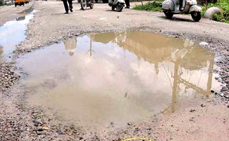 Heavy rain exposes poor conditions of roads