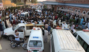 Pakistan's Shiites mourn 61 killed in mosque bombing