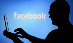Facebook lets users click to report fake news