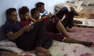 Separated by war, Iraqi children wait for parents