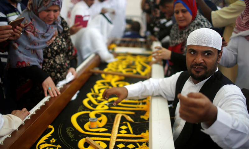 Saudi factory stitches gold-laced cover for Islam's holiest site