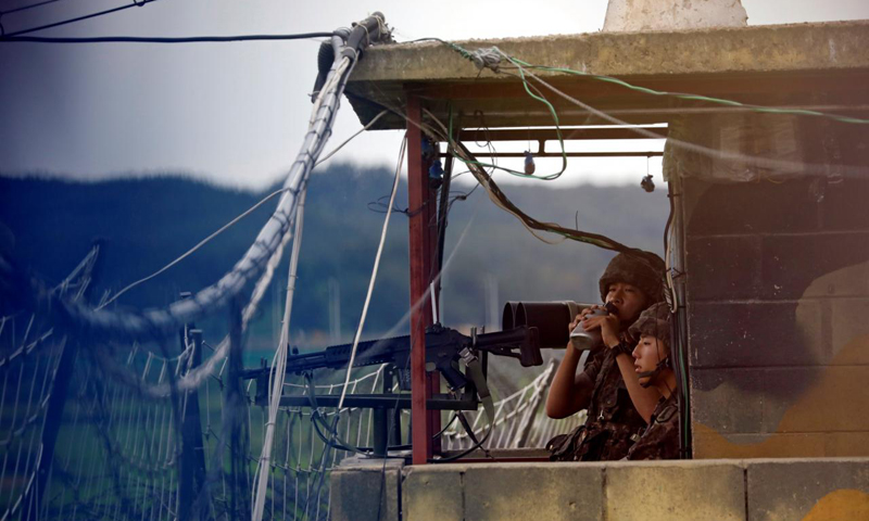 Korea tensions ease slightly as U.S. officials play down war risks