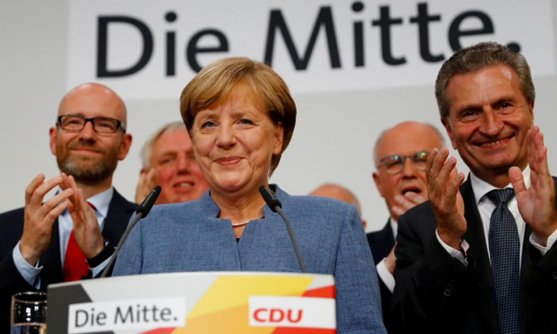 Chastened Merkel braces for coalition tussle after vote
