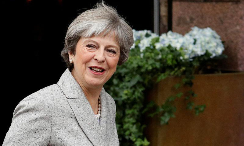 Taking on critics, Britain's May vows to deliver policies and Brexit