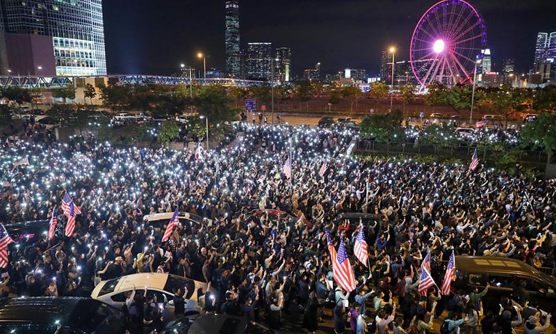 China warns U.S. over Hong Kong law as thousands stage 'Thanksgiving' rally