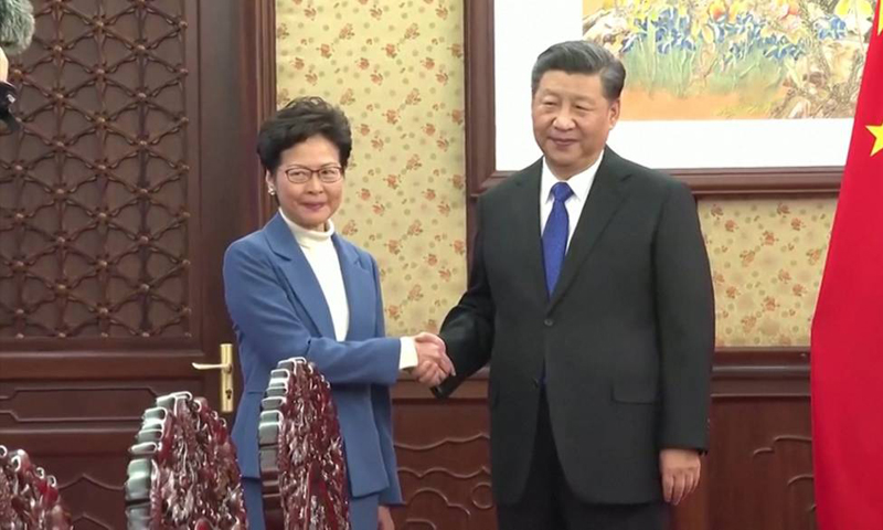 China's Xi vows support for Hong Kong leader during 'most difficult' time