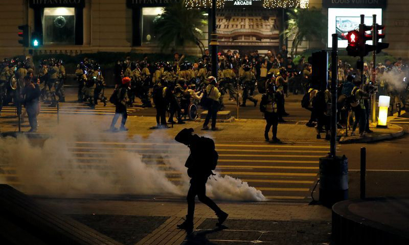 Hong Kong police fire tear gas to break up Christmas Eve protest chaos