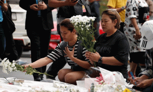 Mourners leave flowers at Thai shopping mall after mass shooting