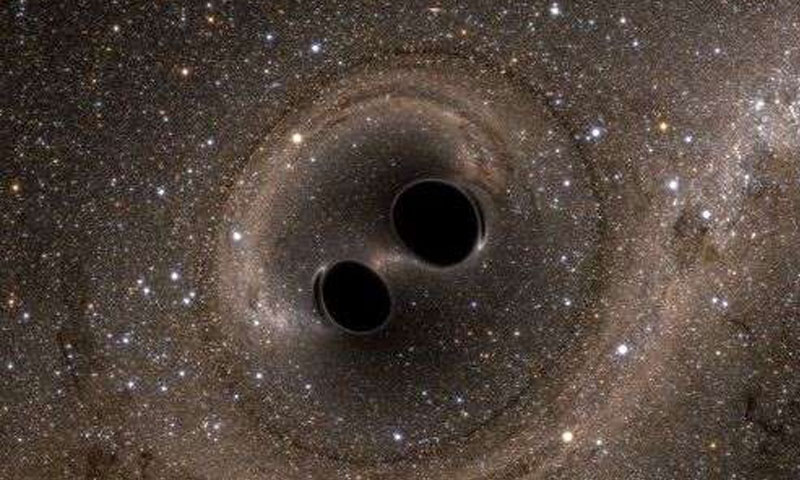 Two Black Holes Are Merging at the Center of a Distant Galaxy