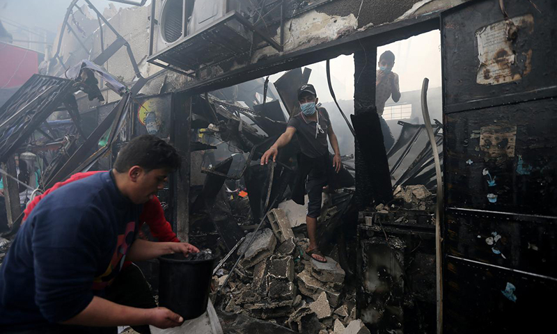 Nine killed in Gaza as bakery fire spreads through packed market