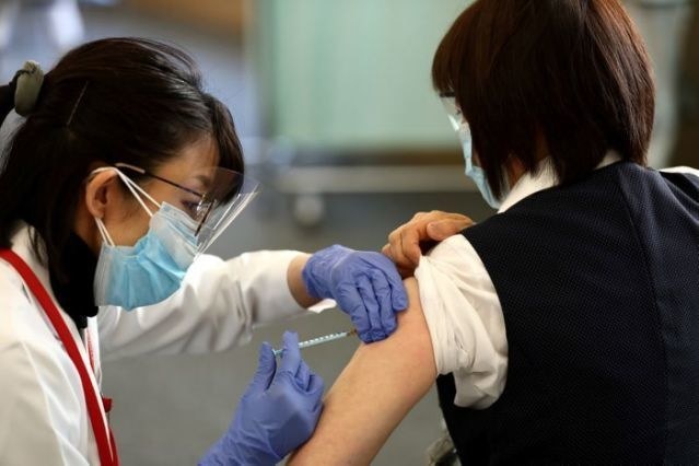 Japan begins COVID-19 vaccination in 'first major step' to halt pandemic