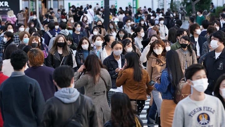 Japan finds new COVID-19 strain, while immigration centre reports infections