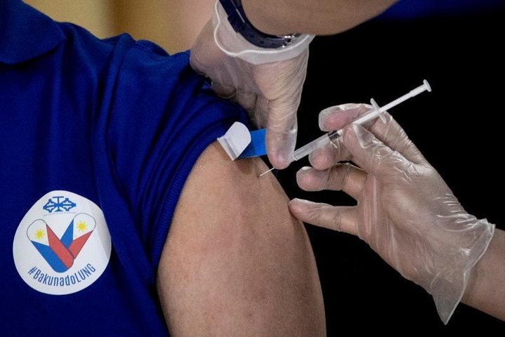 'Light' after darkness as Philippines Covid-19 vaccinations begin