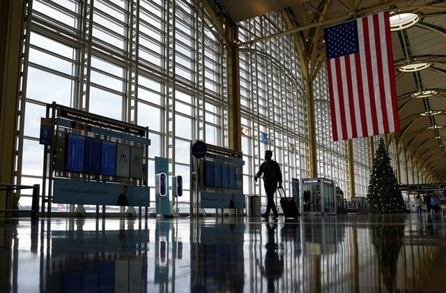 China, U.S. should lift COVID-19 travel bans if herd immunity reached, Chinese epidemiologist says