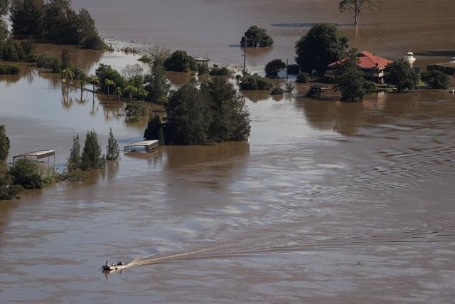 Some Australians return home as others evacuated in floods crisis