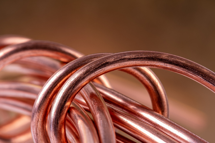 Copper clings to gains near record high on demand hopes