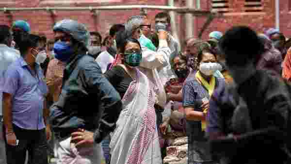 India's virus cases lower but WHO expert says positive tests ominously high