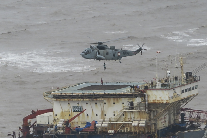 Indian Navy scours the sea for dozens missing after cyclone