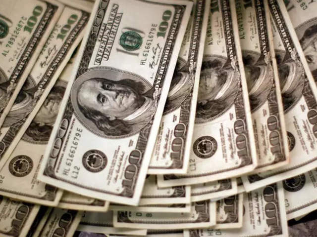 Dollar rises on upbeat U.S. manufacturing data