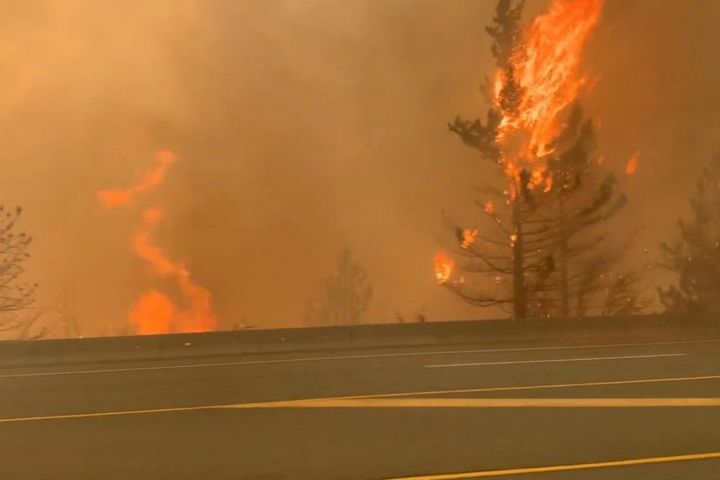 Wildfires rage as heat wave stifles western US, Canada