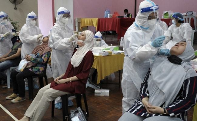 Malaysia shuts Covid jab centre after 200 workers infected