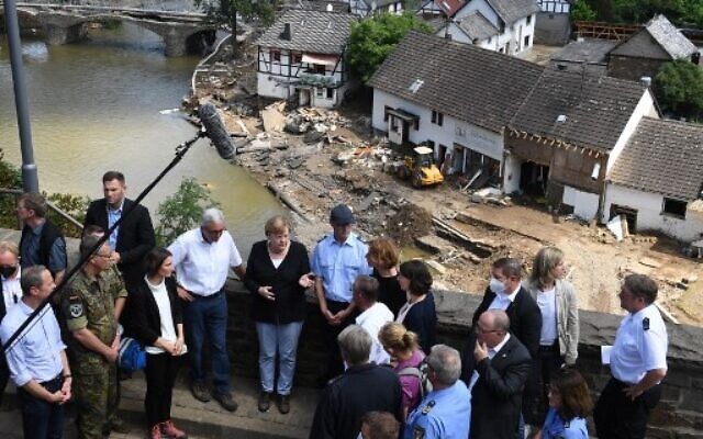 Merkel sees 'surreal' wreckage as Europe flood death toll tops 180