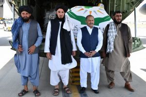 Ambassador Mansoor Ahmad and the Afghan officials pose for a picture at the Hamid Karzai International Airport. APP