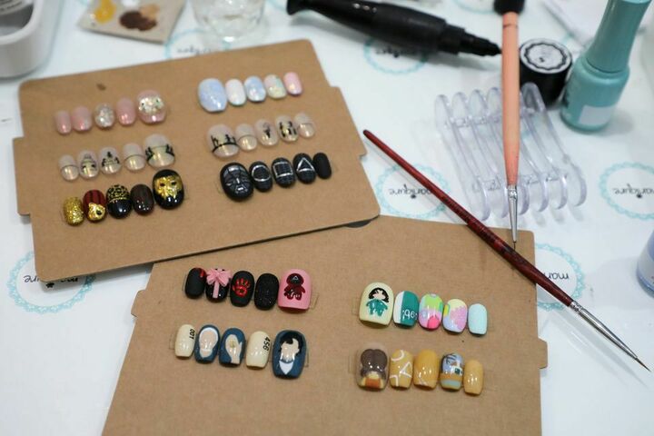 Malaysian salon paints Squid Game manicures of tiny coffins, green tracksuits