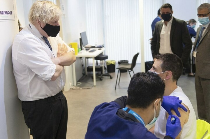 As virus surges, England builds temporary hospitals