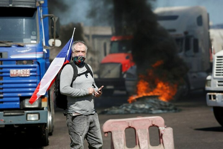 Trucker's death during row with migrants in Chile spurs new protests