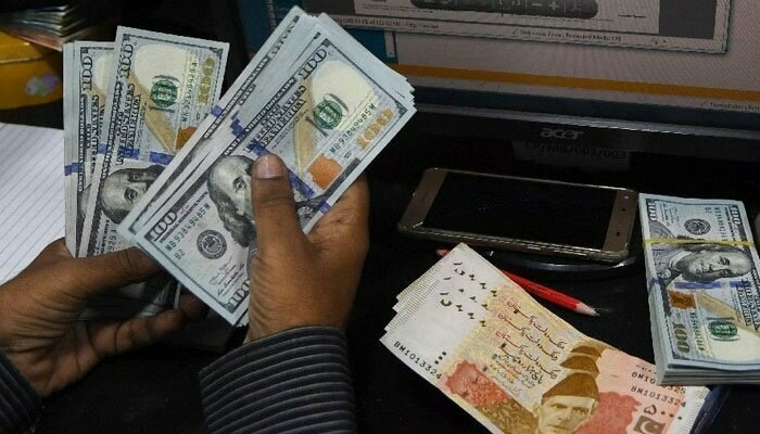Rising oil prices push Pakistan's rupee lower against US dollar