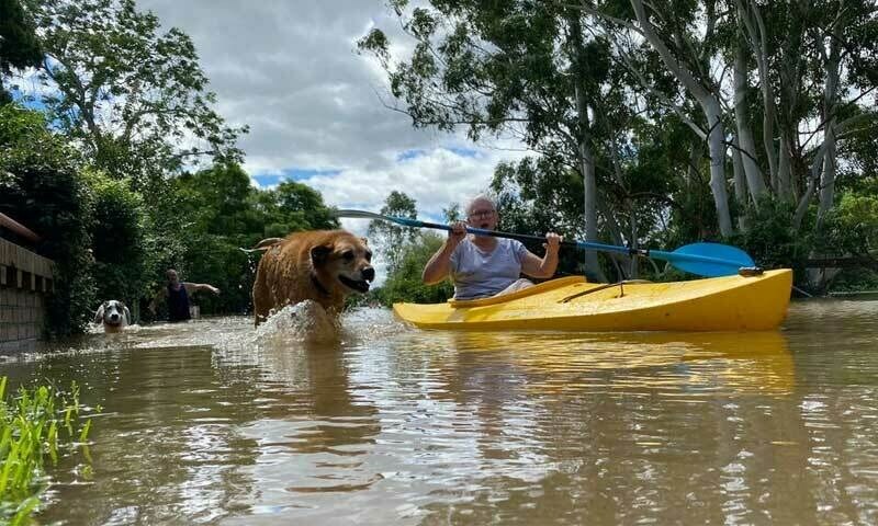 Protesters rally as Australian PM tours flood disaster