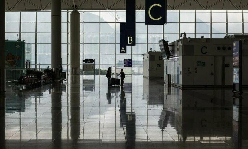 Hong Kong halves flight suspensions triggered by Covid cases