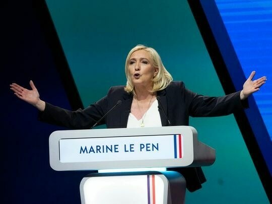 Le Pen vows headscarf fines in tight French election battle