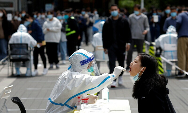 Some in Shanghai come out for air as Beijing resumes mass Covid tests