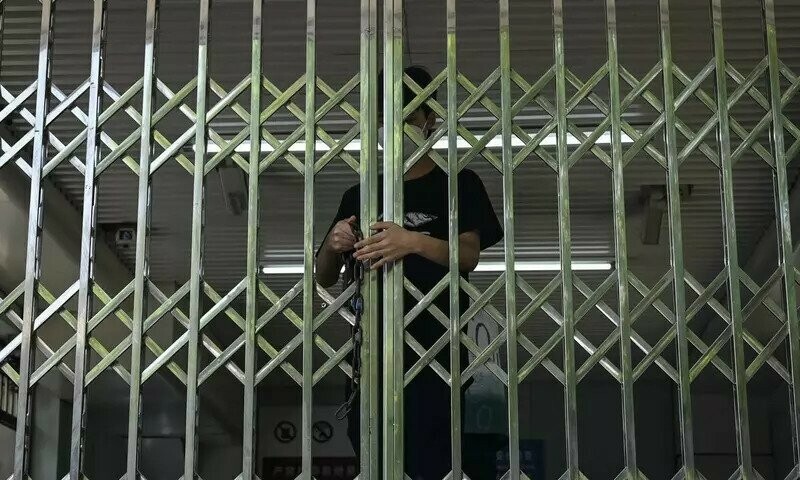 Beijing closes dozens of subway stations as Covid controls tighten