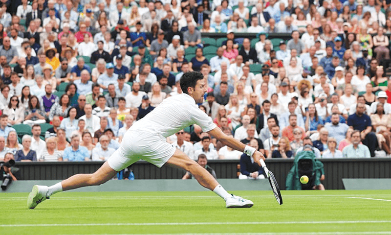 Djokovic survives scare to win 80th match at Wimbledon