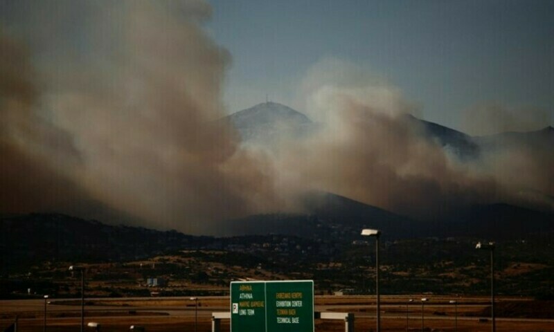 Wildfire rages near Athens; homes damaged, hospital evacuated