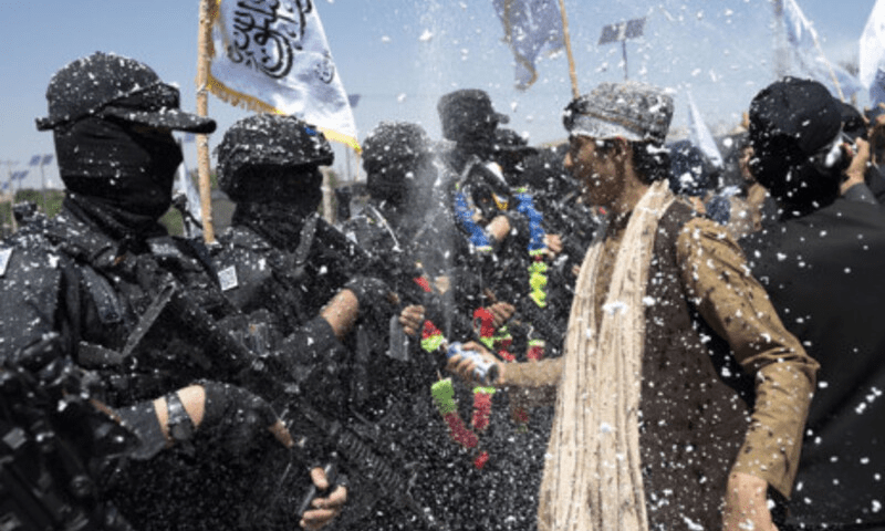 Taliban mark anniversary of foreign troop exit with chants, military parade