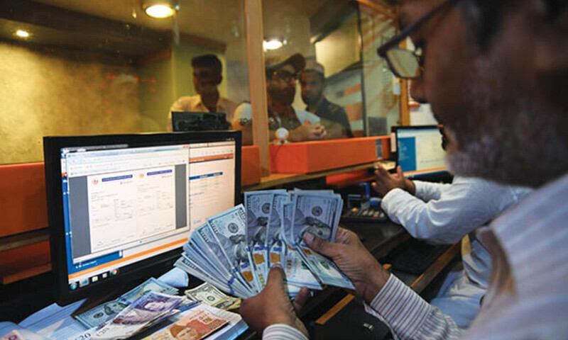 Dollar falls to new low as rupee gets strong