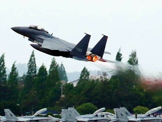 North Korea fires missile, flies fighter jets near border