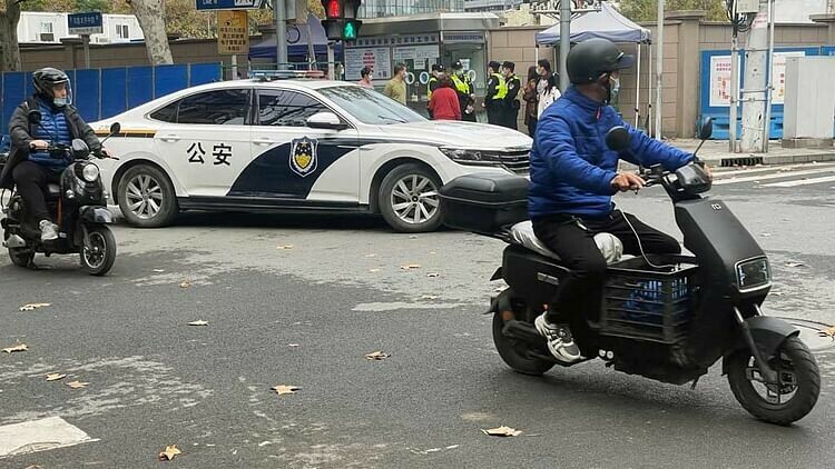 China tightens security after rare protests against COVID curbs