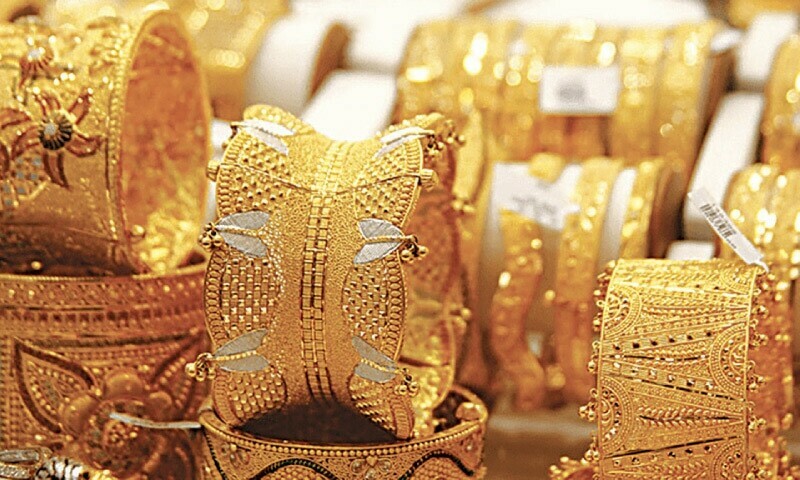 Gold soars to another record high amid economic woes