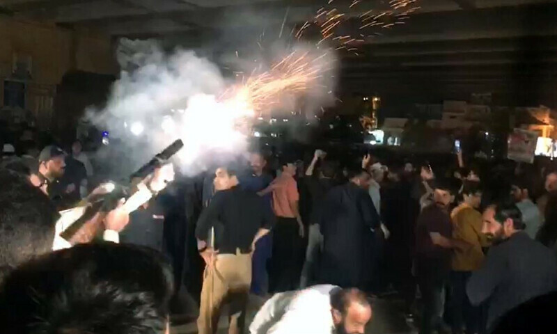 Police officials and Workers of Tehreek-e-Insaf (PTI) are standing face to face while PTI workers barricades police to arrest former prime minister Imran Khan in the Toshakana case, outside Zaman Park in Lahore on Tuesday, March 14, 2023. Law enforcers and Pakistan Tehreek-e-Insaf (PTI) workers clashed Tuesday as a heavy contingent of police reached Zaman Park to arrest former prime minister Imran Khan in the Toshakana case, the only case in which his arrest warrants are not suspended – PPI