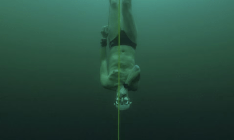 Free-diver plunges to record depth beneath frozen Swiss lake