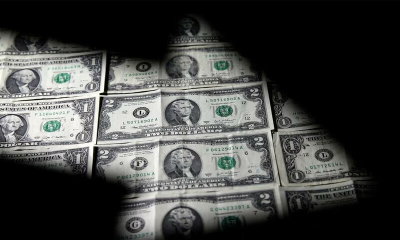 Dollar sinks to one-year low as cooling inflation raises Fed pause expectation